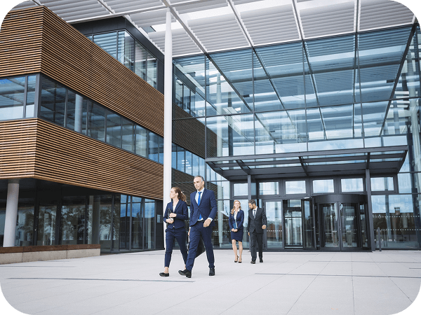 Business professionals outside a modern office